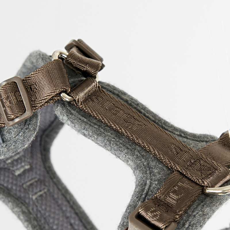 Close-up of the buckles on the stone wool-felt Numa harness