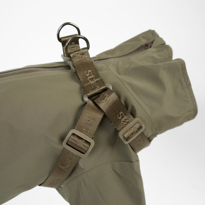 The moss green rain coat with harness seen from the side