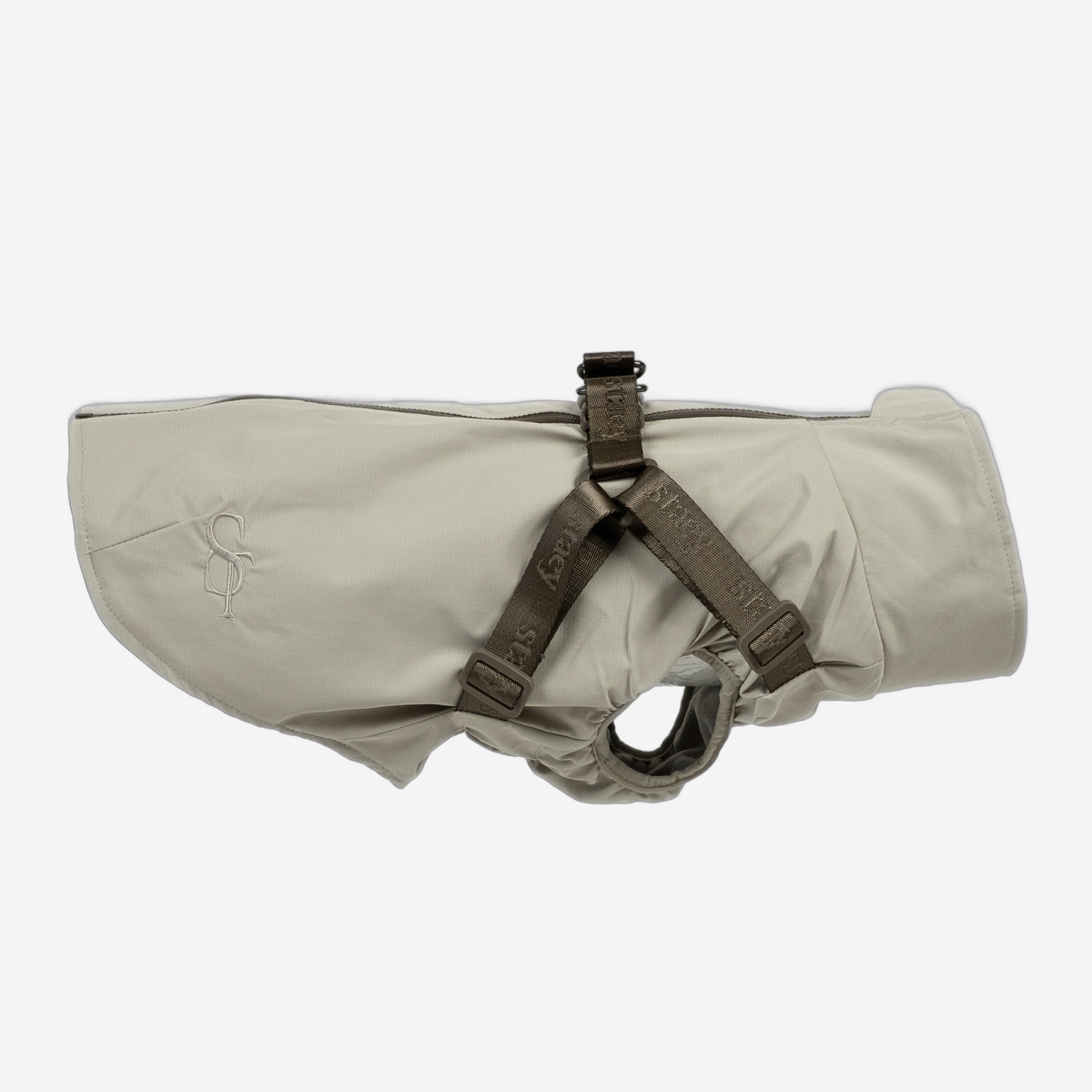Manteau imperméable pour chien Norma, couleur beige naturel, avec harnais intégré, vue de profil